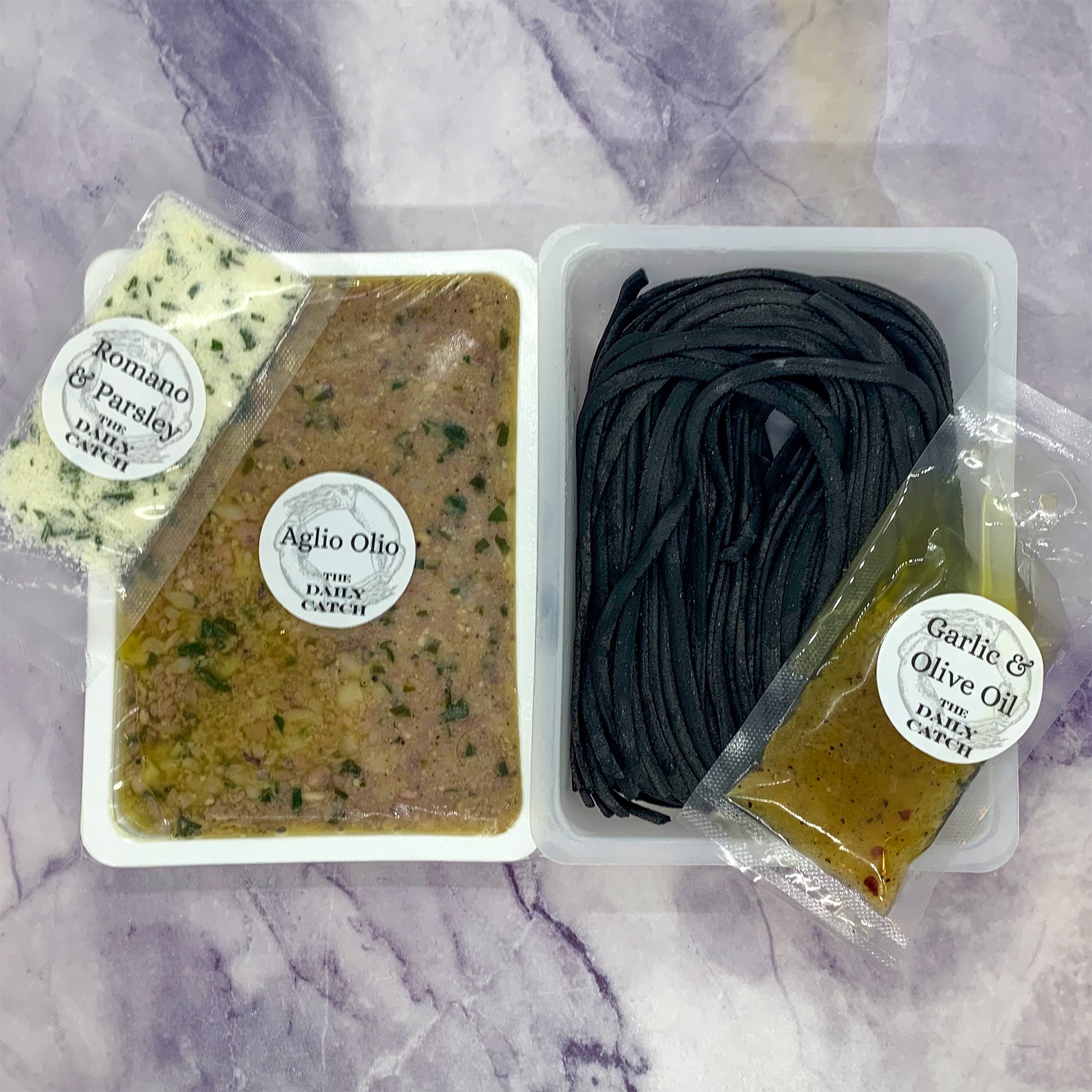 https://shop.thedailycatch.com/cdn/shop/products/black_pasta_aglio_olio_meal_kit_ingredients.jpg?v=1644554785